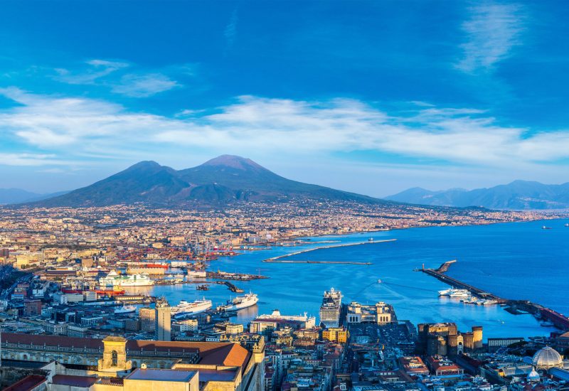 Napoli (Naples) and mount Vesuvius in the background at sunset in a summer day, Italy, Campania